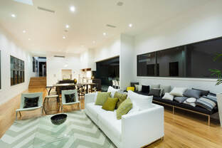 Picture of a clean modern living are with amazing lighting. Home cleaned by professional experts in house cleaning.